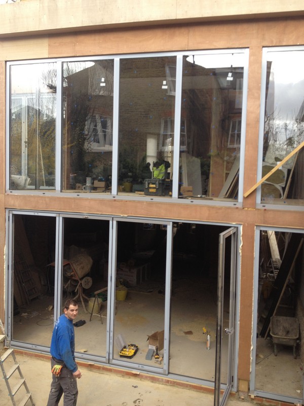 Aluminium bi-fold doors with two-storey glazing in New Cross Gate
