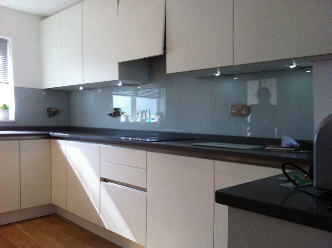 Grey glass kitchen splashback with LED lighting in New Cross Gate