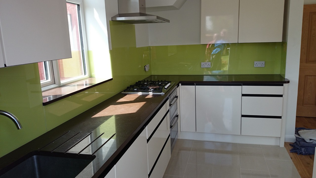 Lime green glass kitchen splashback installed by New Cross Gate glaziers