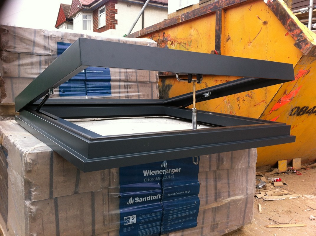 Opening flat roof skylight in anthracite grey installed in New Cross Gate